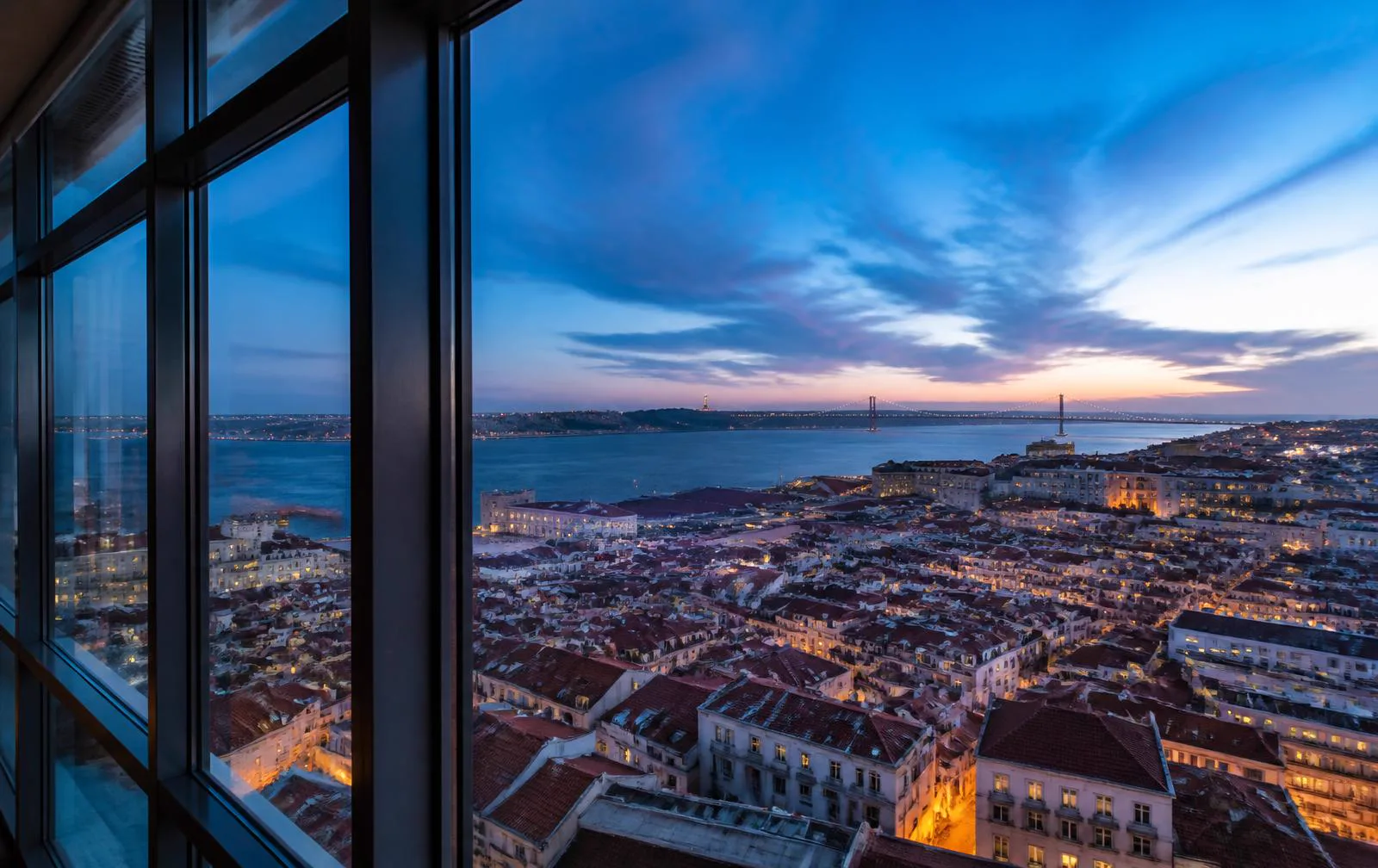 View over Lisbon and the Tagus river at dusk